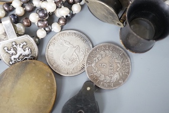 A collection of coins, magnifying loupes, cultured pearl necklace, etc.